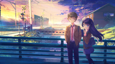 Anime characters Sakuta Azusagawa and Mai Sakurajima stand on a bridge during a picturesque sunset. Sakuta has brown hair and eyes, Mai has purple hair and blue eyes, and both are in school uniforms.