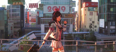 An HD desktop wallpaper featuring Kizuna AI from AI Channel in an anime style. She is pictured standing in a cityscape, animated and lively, with various colorful signs and buildings in the background.