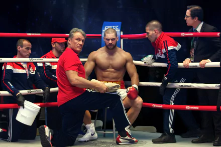 HD wallpaper from Creed II featuring Dolph Lundgren in a boxing ring with a focused athlete, perfectly capturing a dramatic moment for desktop backgrounds.