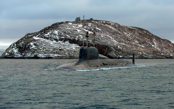 4K Ultra HD desktop wallpaper featuring a military submarine partially submerged near a rocky, snow-dusted island under a cloudy sky.