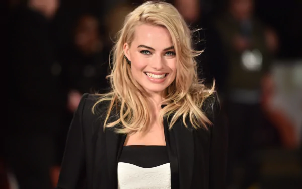 Blonde-haired celebrity Margot Robbie smiles brightly in this 4K Ultra HD desktop wallpaper and background.