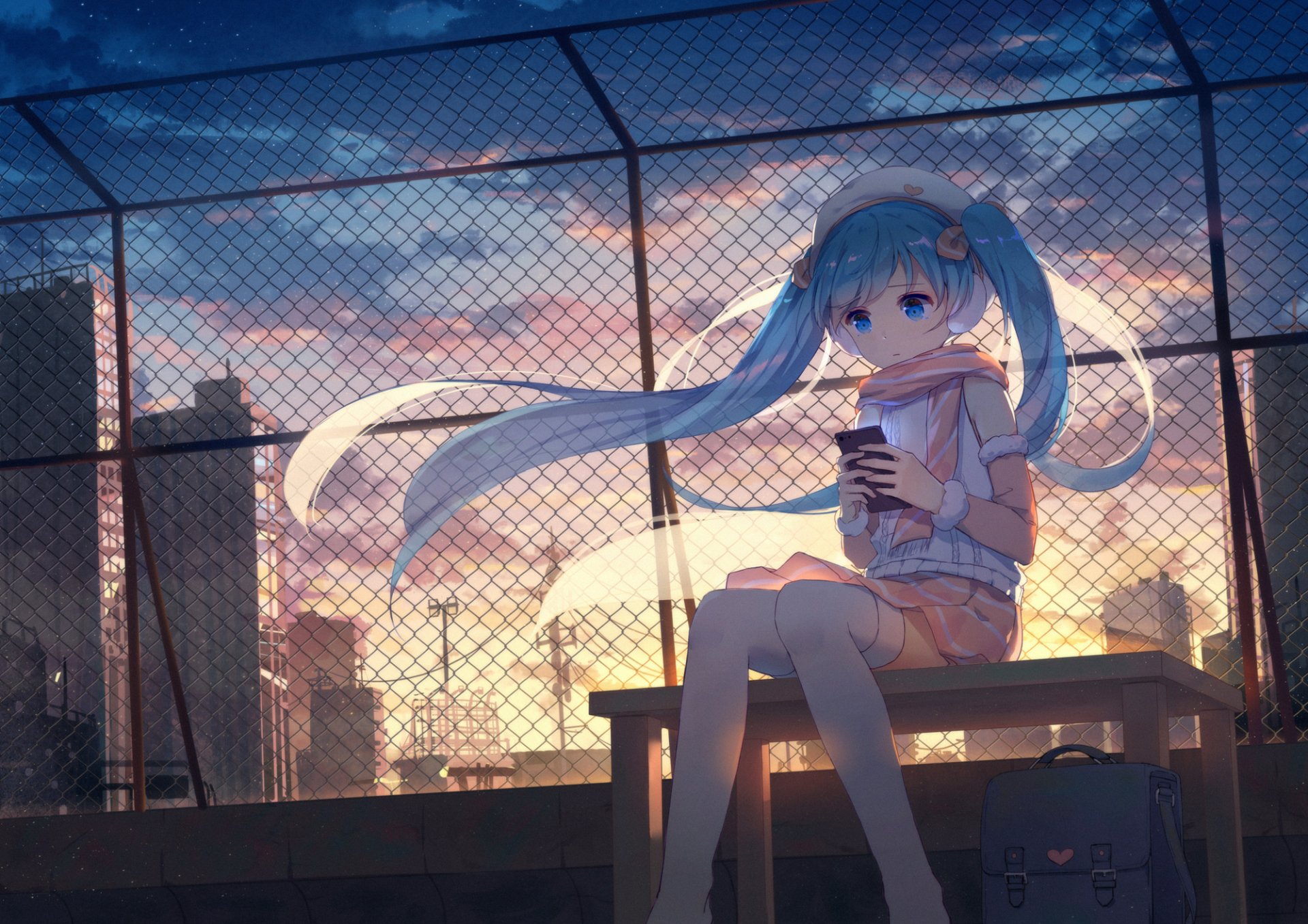 A serene anime scene featuring Hatsune Miku with blue eyes and hair, holding a phone. The background shows a rooftop during sunset, creating a picturesque HD desktop wallpaper and background.