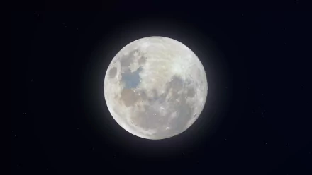 8K Ultra HD wallpaper showcasing a bright super snow moon surrounded by subtle stars against a dark night sky, capturing the beauty of nature and celestial wonder.