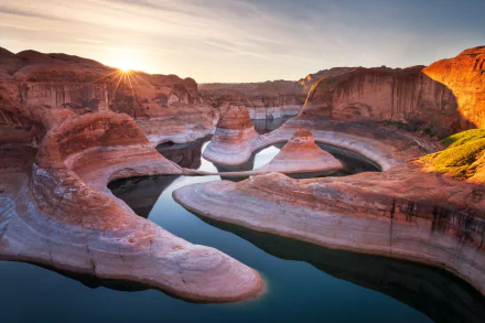 Sunrise over the winding river and red rock formations of Lake Powell canyon in the USA, captured in a stunning HD desktop wallpaper.