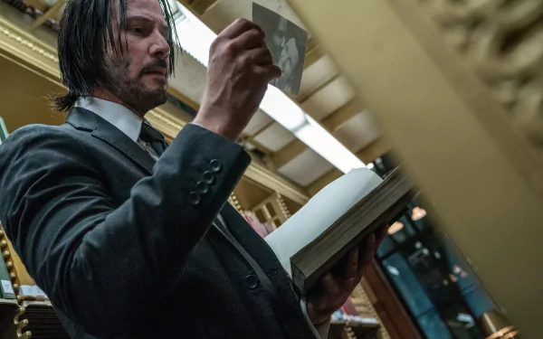 Keanu Reeves as John Wick in a scene from John Wick: Chapter 3 – Parabellum, captured in 4K Ultra HD for a detailed PC desktop wallpaper.
