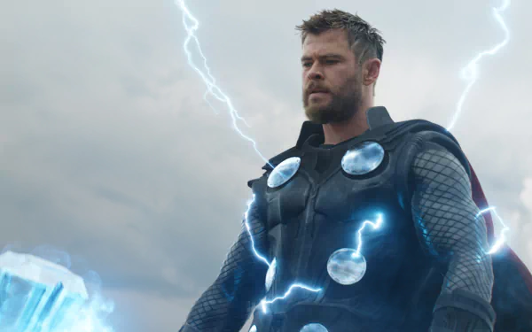HD desktop wallpaper of Chris Hemsworth as Thor, bearded and in armor, surrounded by lightning from the Avengers: Endgame movie.