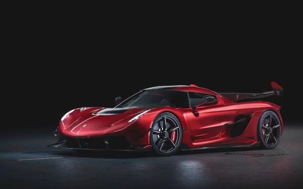 Red Koenigsegg Jesko supercar showcased against a dark background, captured in 8K Ultra HD as a sleek, high-performance vehicle desktop wallpaper.