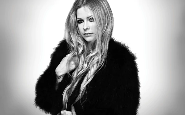 Monochrome 5K desktop wallpaper showing a long-haired Canadian singer in a black fur coat, intense gaze in a studio music portrait.