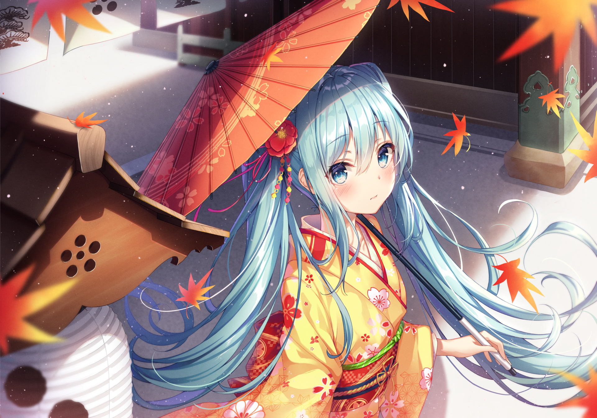 Anime-style HD wallpaper of Hatsune Miku with blue hair and blue eyes, holding a red umbrella. She is wearing a traditional yellow kimono surrounded by falling autumn leaves in an outdoor setting.