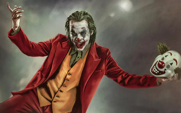 4K Ultra HD PC desktop wallpaper/background: movie Joker in red suit and yellow vest, smeared clown makeup, arms wide, holding a grinning clown mask in a smoky haze.