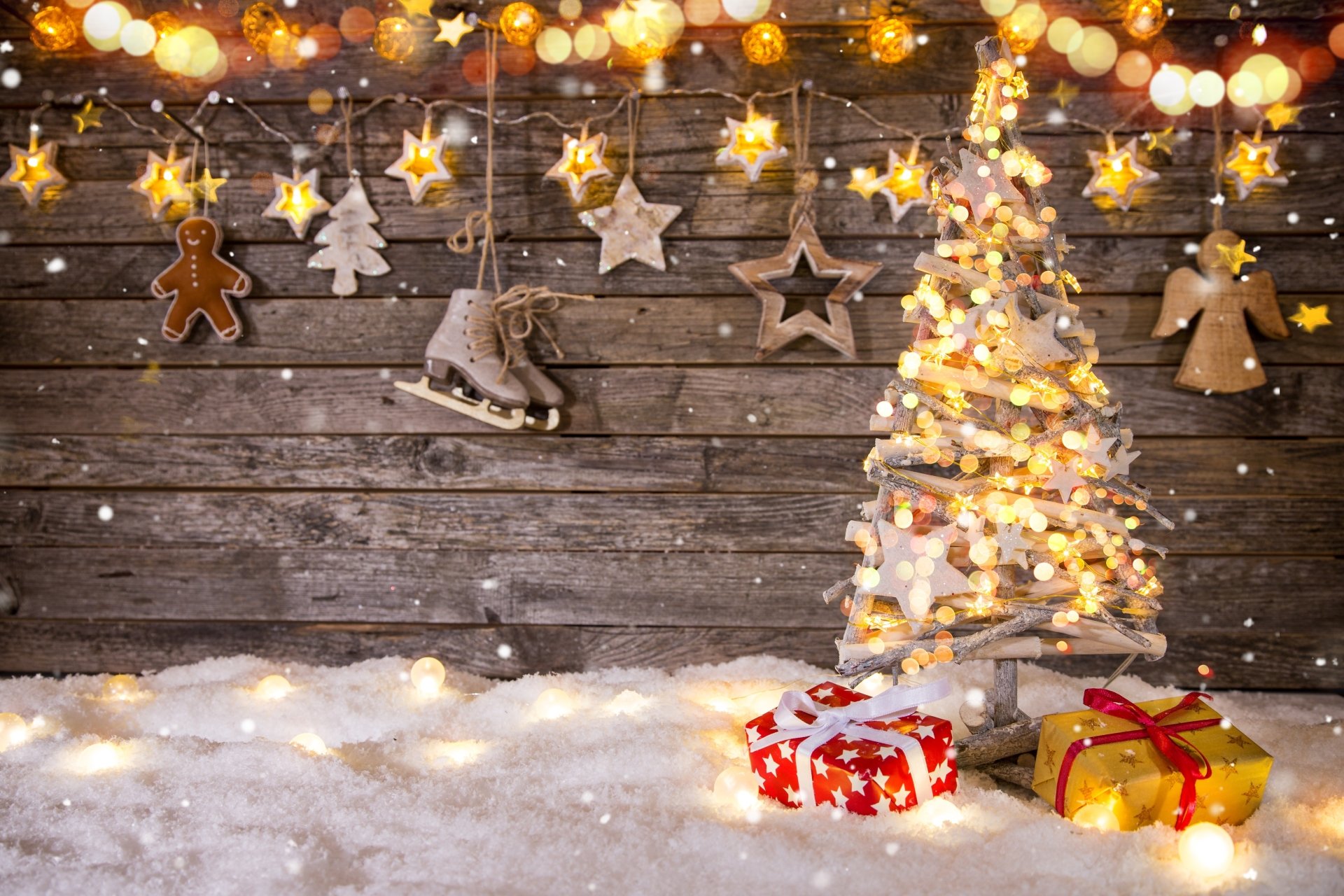 A warm holiday scene with glowing Christmas lights, festive ornaments, a decorated Christmas tree, and wrapped gifts against a rustic wooden background.