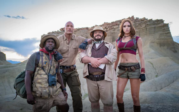 5K Ultra HD wallpaper for Jumanji: The Next Level — four costumed leads in rugged explorer gear, including a bearded adventurer and a woman in shorts, standing on rocky desert terrain.
