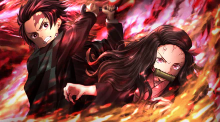4K Ultra HD anime wallpaper featuring Tanjiro Kamado and Nezuko Kamado performing Hinokami Kagura from Demon Slayer: Kimetsu no Yaiba in a fiery battle scene.