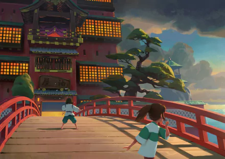 HD desktop wallpaper featuring a scene from the anime Spirited Away with two characters on a red bridge, leading to an ornate building against a dusk sky.