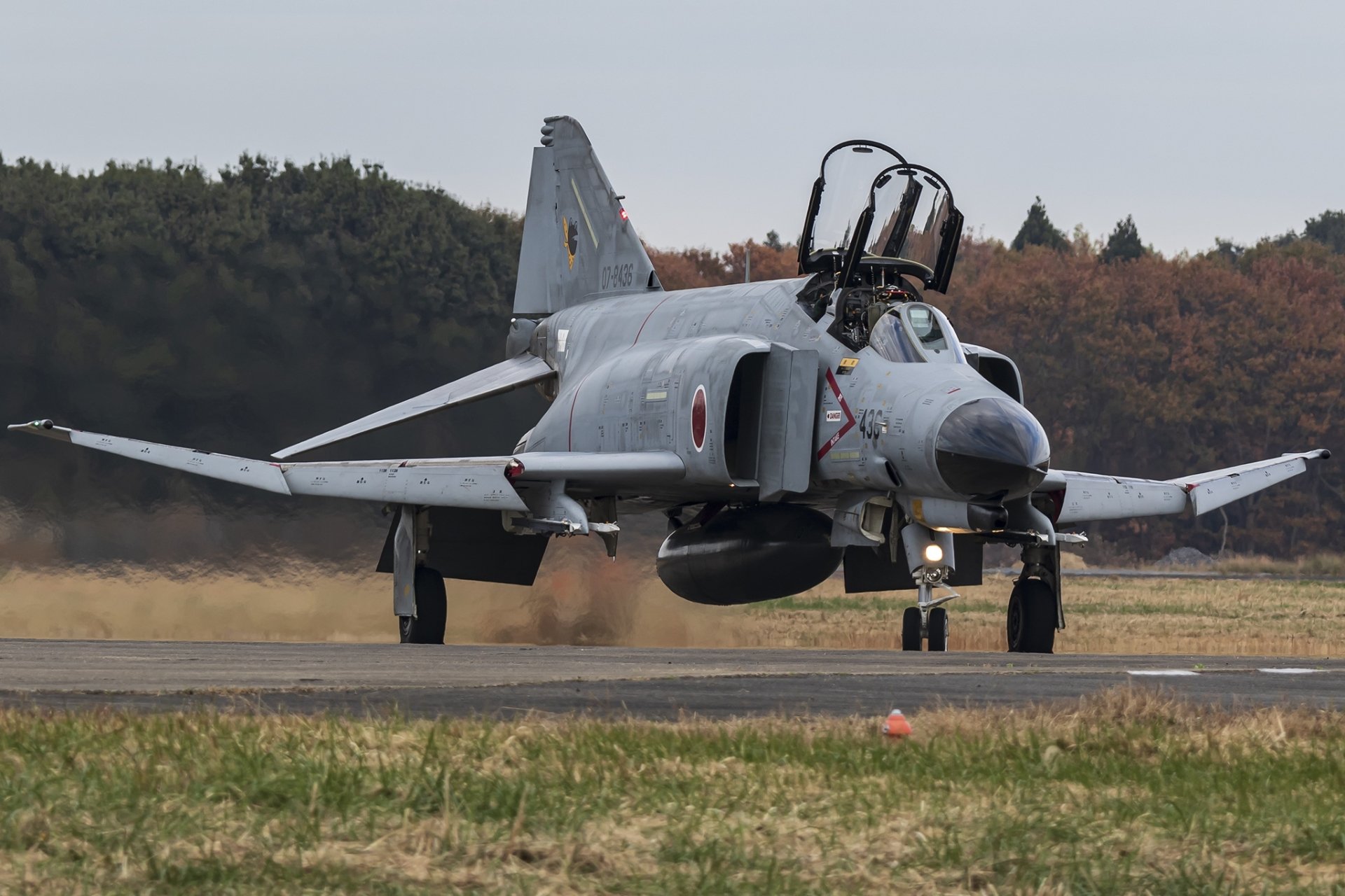 McDonnell Douglas F-4 Phantom II military jet fighter warplane on runway, captured in high-definition for PC desktop wallpaper and background.