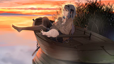 HD PC desktop wallpaper of an anime girl reclining in a wooden rowboat at sunset, blue-gray hair and school uniform, warm sky reflected on calm water with reeds along the shore.