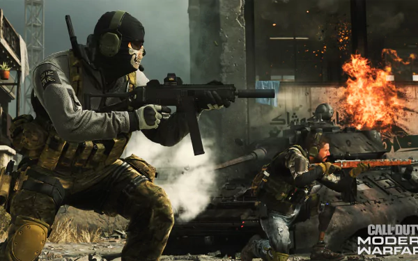 Call of Duty: Modern Warfare HD PC desktop wallpaper — masked operator fires rifle in urban firefight, explosions and soldiers take cover amid rubble.