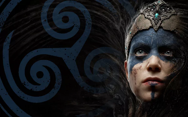 HD PC desktop wallpaper of Senua from the video game Hellblade: Senua's Sacrifice — close-up of her painted face and ornate headpiece against dark blue Celtic spirals.