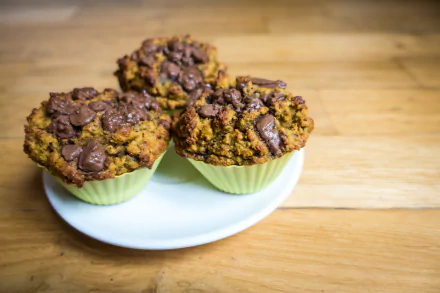  Homemade muffins with huge chunks of chocolate by Jakub Kapusnak