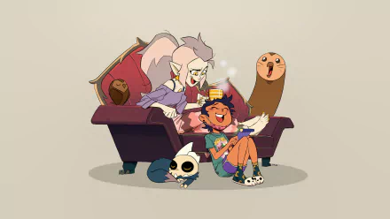 Characters Eda Clawthorne, Luz Noceda, King Clawthorne, and Hooty from The Owl House sitting on a couch, with cheerful expressions in an HD desktop wallpaper.