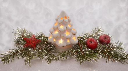 4K Ultra HD PC wallpaper featuring a Christmas-themed decoration with a glowing white candle shaped like a tree, red ornaments, and green pine branches dusted with snow.