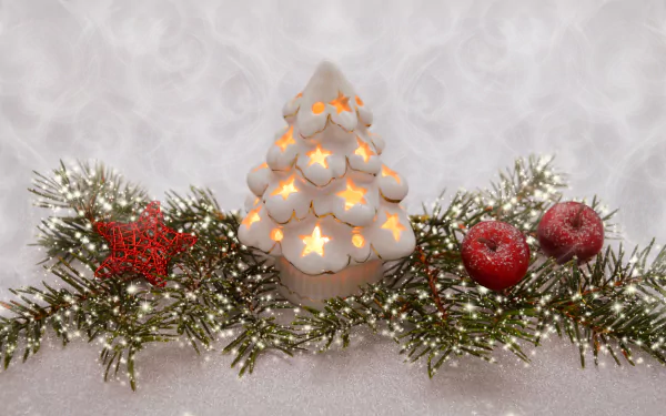 4K Ultra HD PC wallpaper featuring a Christmas-themed decoration with a glowing white candle shaped like a tree, red ornaments, and green pine branches dusted with snow.