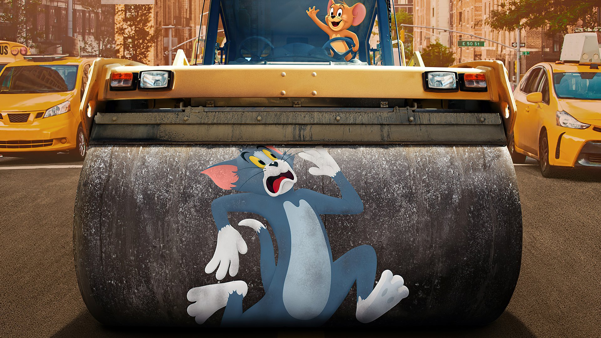 4K Ultra HD PC desktop wallpaper featuring Tom and Jerry from Tom & Jerry movie, with Jerry atop a steamroller and Tom painted on its roller in a city street scene.