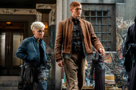 HD desktop wallpaper from The Watch featuring two characters standing in a gritty urban setting.