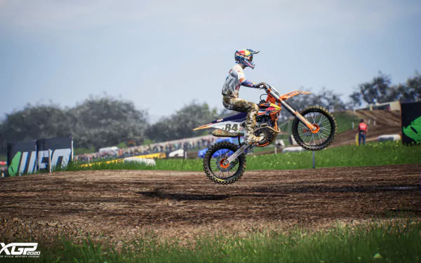 MXGP 2020 game wallpaper featuring a motocross rider performing a jump on a dirt track.