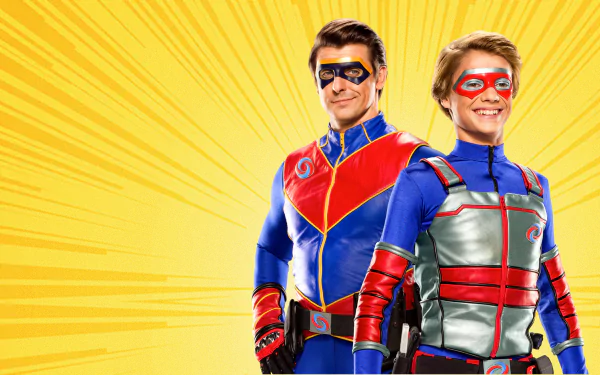HD desktop wallpaper featuring two characters from Henry Danger standing heroically against a vibrant yellow background with rays.