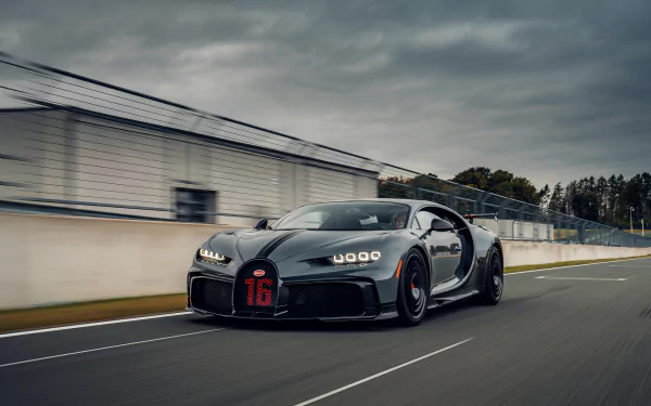 Bugatti Chiron Pur Sport supercar in motion on a racetrack, captured in 4K Ultra HD for a stunning PC desktop wallpaper and background.