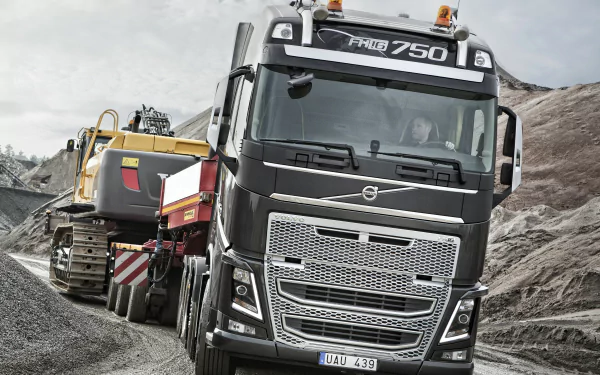 A Volvo FH16 750 truck on a rugged construction site, providing HD desktop wallpaper material with a clear Volvo branding.