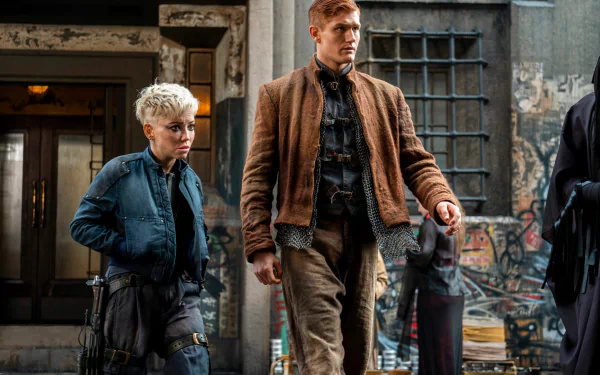 HD desktop wallpaper from The Watch featuring two characters standing in a gritty urban setting.