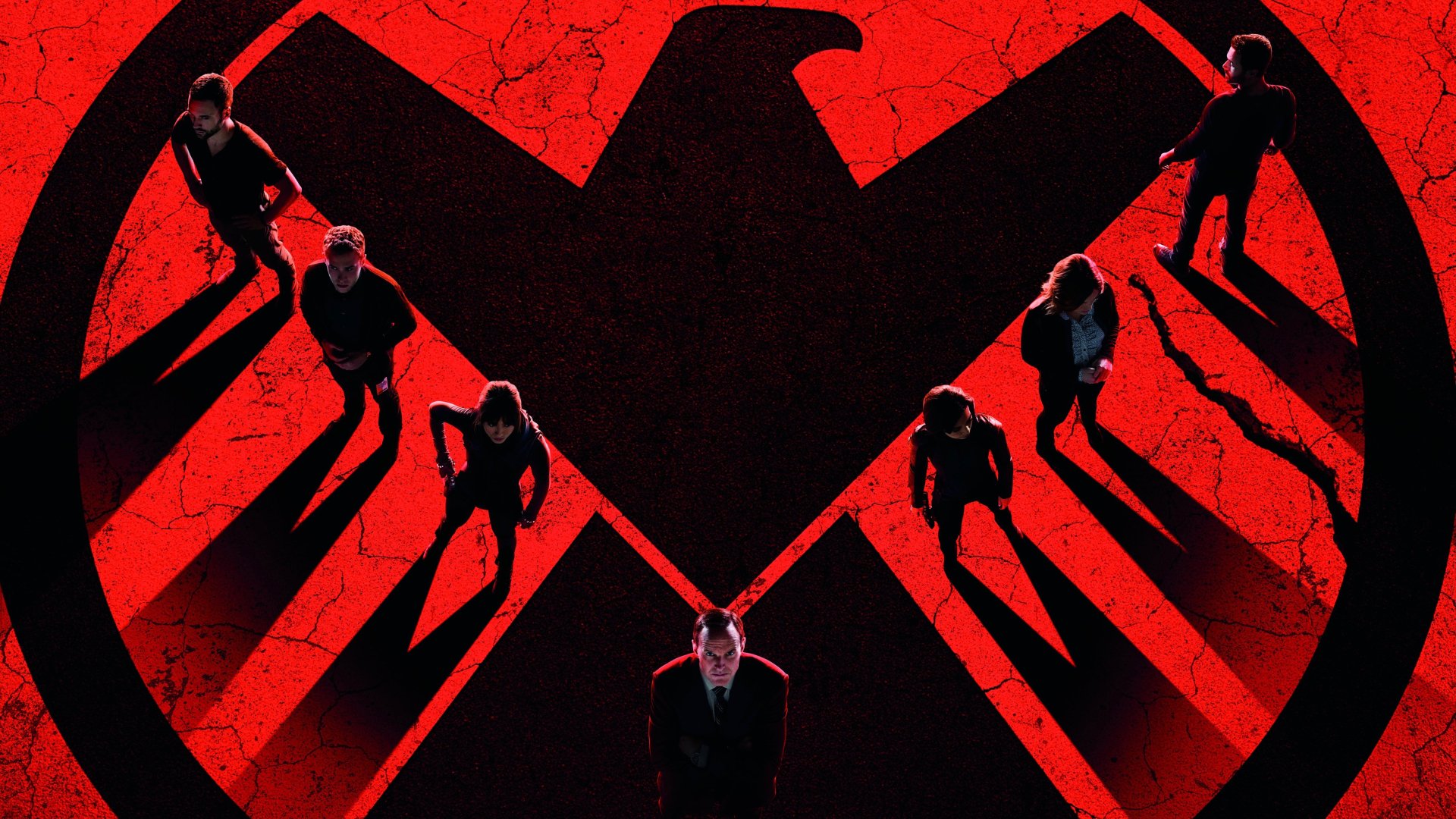 A dynamic 4K Ultra HD wallpaper featuring characters from Marvel's Agents of S.H.I.E.L.D. against a striking red background and the S.H.I.E.L.D. emblem.
