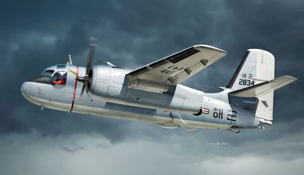 Grumman C-2 Greyhound military transport aircraft (warplane) flying through stormy clouds — twin‑engine carrier delivery plane, HD PC desktop wallpaper background.