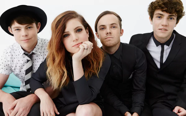 HD wallpaper featuring Echosmith with Sydney Sierota posing with band members against a white background.