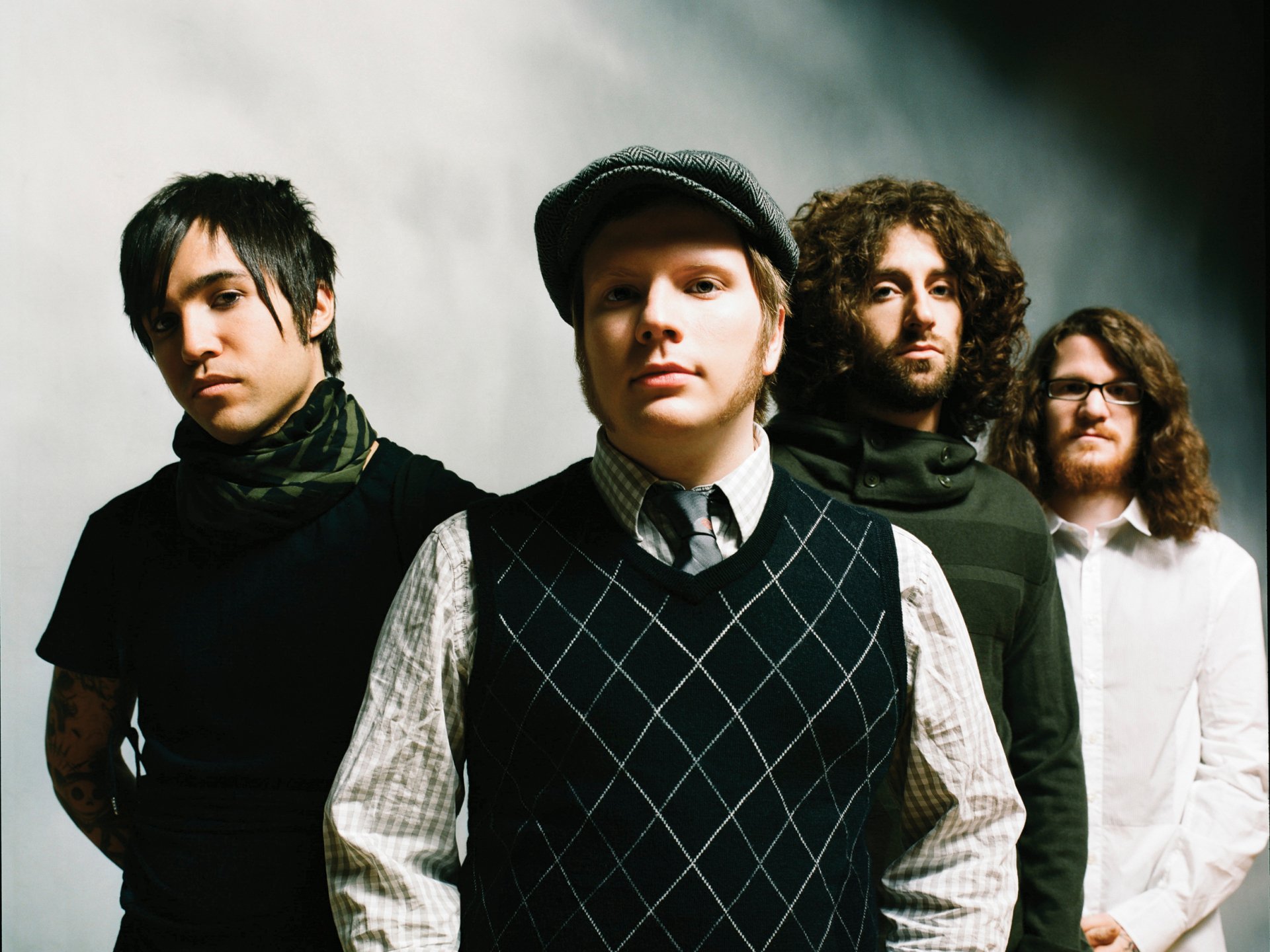 HD desktop wallpaper featuring the band Fall Out Boy posing against a plain background.