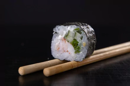  Sushi maki roll with black background