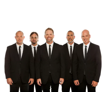 HD desktop wallpaper featuring the band MercyMe, five members dressed in black suits against a white background.