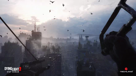 HD PC desktop wallpaper from the video game Dying Light 2: Stay Human — first-person rooftop view over a foggy, bird-filled city skyline, gloved hands gripping a zipline.