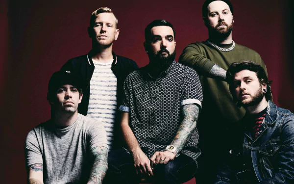 HD desktop wallpaper featuring a posed group of five band members against a red backdrop, tagged with A Day To Remember.