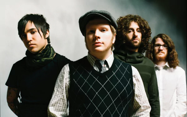 HD desktop wallpaper featuring the band Fall Out Boy posing against a plain background.