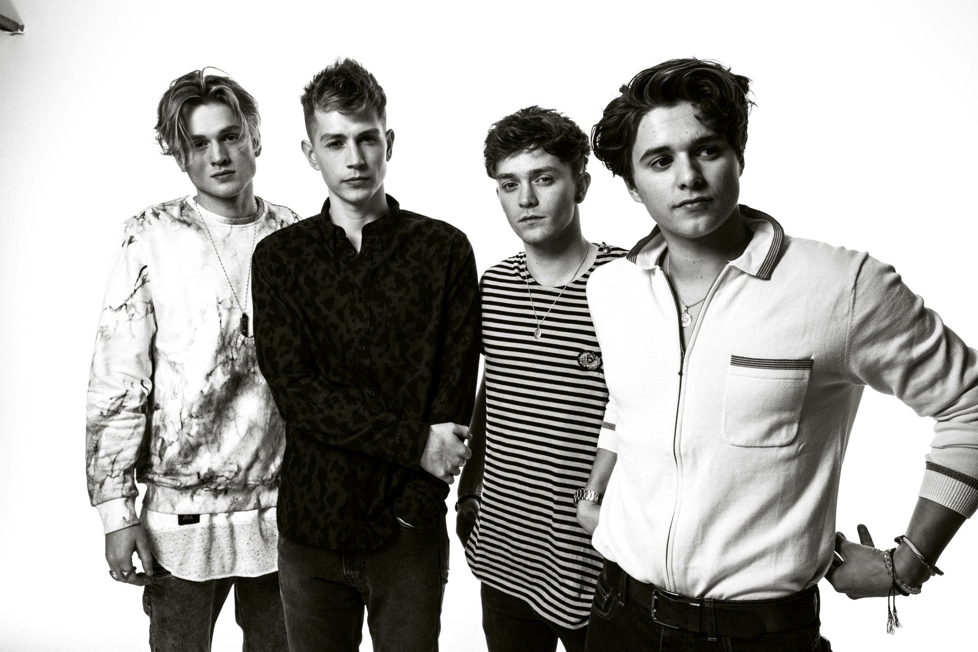 HD wallpaper featuring the band The Vamps, with members in a black and white group portrait for a desktop background.