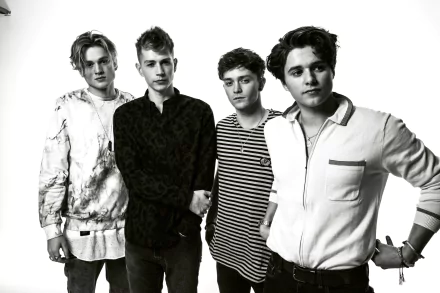 HD wallpaper featuring the band The Vamps, with members in a black and white group portrait for a desktop background.