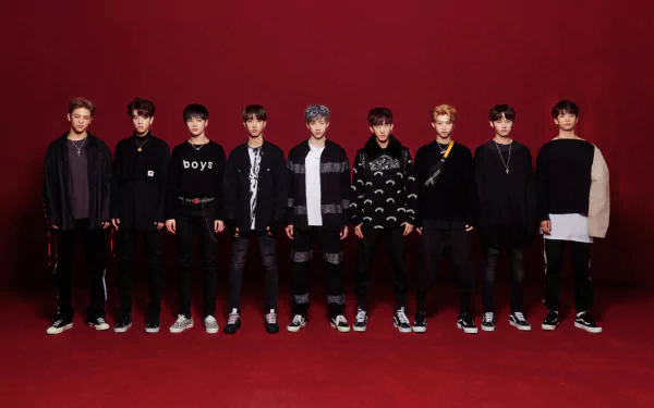 HD PC desktop wallpaper featuring the K-pop boy band Stray Kids posing against a deep red background.