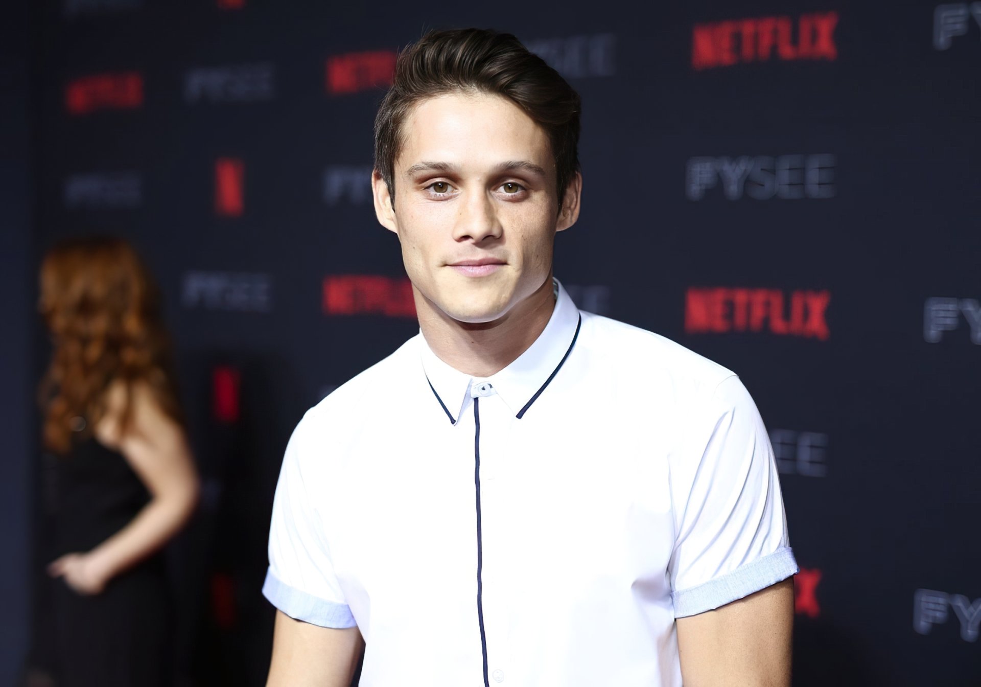 HD desktop wallpaper featuring a person at a Netflix event.