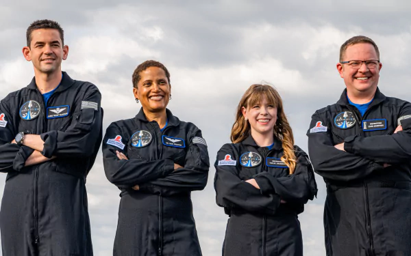 Inspiration4 crew in flight suits posing for HD desktop wallpaper.