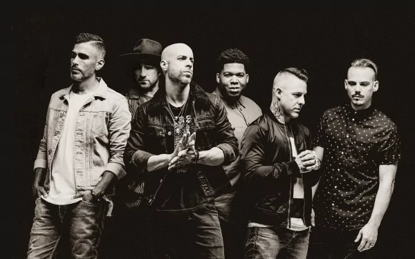A high-definition desktop wallpaper featuring Chris Daughtry and his band, showcasing their dynamic presence and music energy against a dark background.