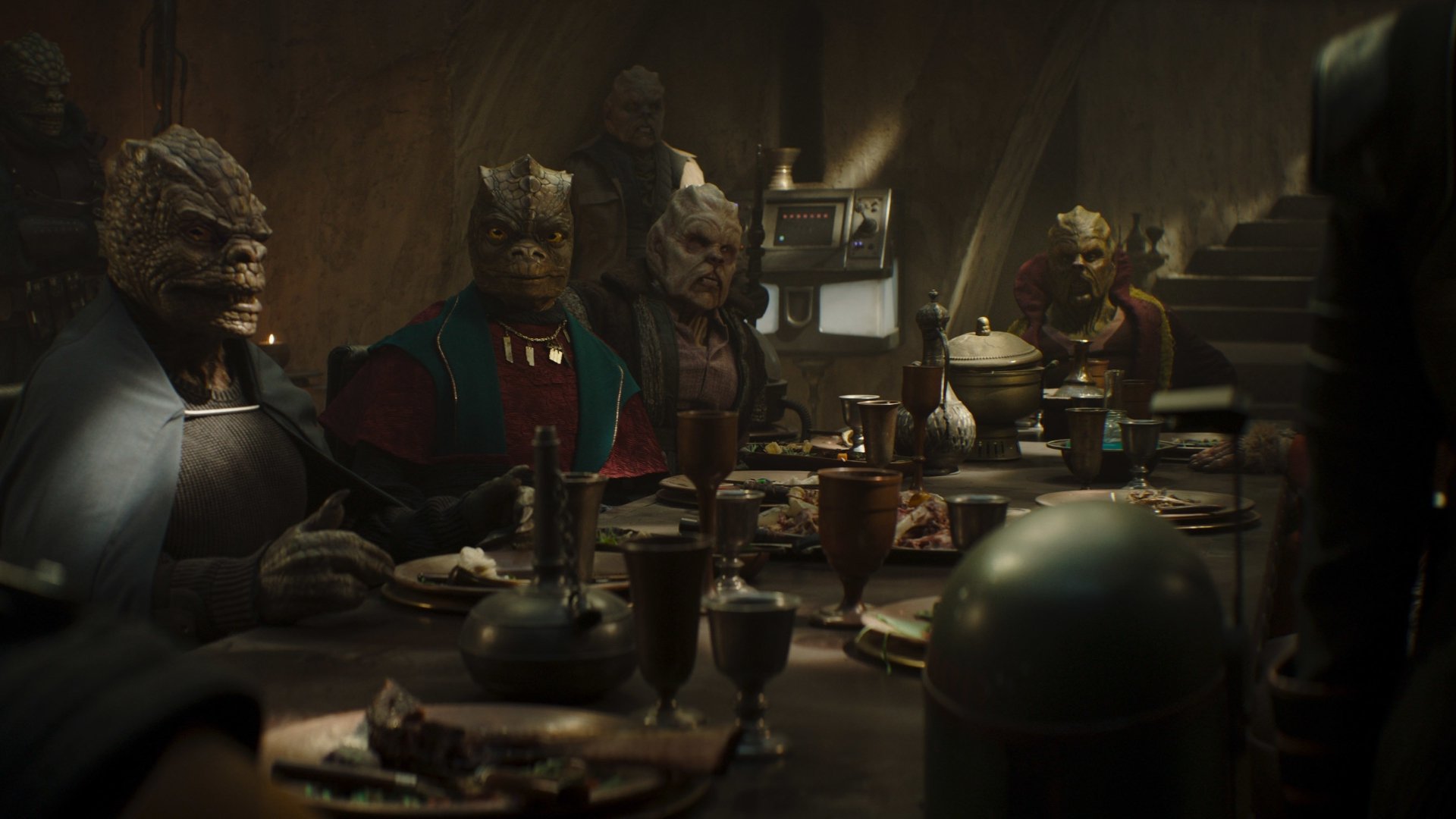 HD PC desktop wallpaper featuring a scene from the TV show The Book of Boba Fett, depicting alien characters gathered around a dimly lit table.