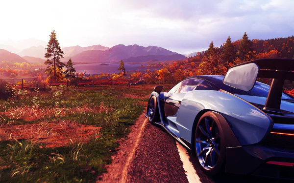 Forza Horizon 4 HD PC wallpaper: sleek supercar on a sunlit country road, autumn foliage and distant mountains in a vibrant Forza video game scene.